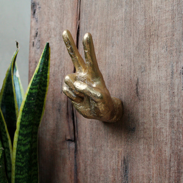 Hand coat hook in shape of Peace sign – Thelermont Hupton